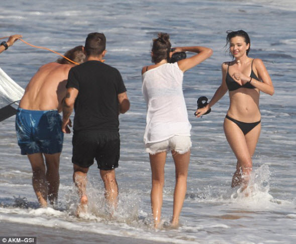 Miranda Kerr wows in a stylish black two-piece as she frolics in Malibu during fun photoshoot