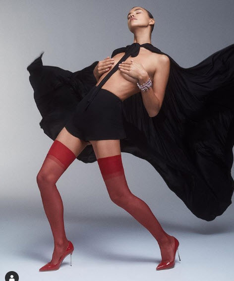 Irina Shayk Poses Topless Under Billowing Cape And Thigh-High Stockings
